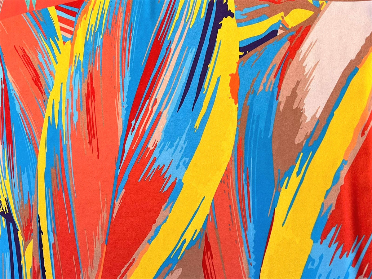 Detalle de seda francesa con brochazos rojo, amarillo, azul cielo y café, estilo pintado a mano