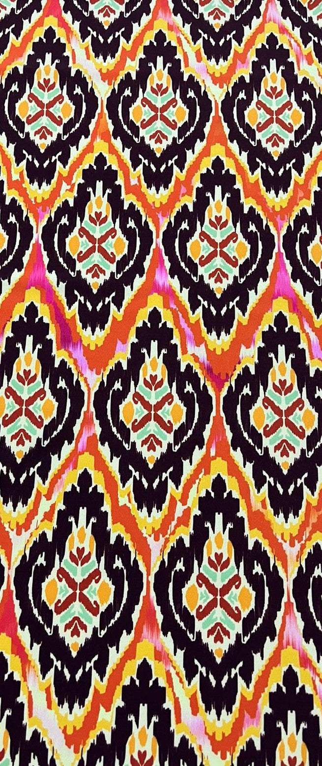 Seda francesa con estampado ikat de medallones vino oscuro y franjas naranja, amarillo y fucsia